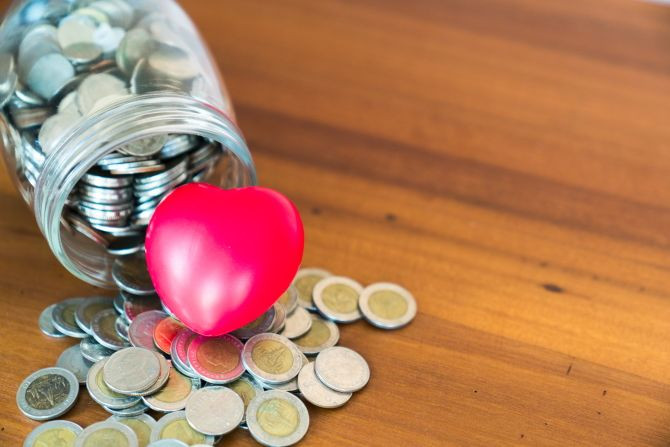 high-angle-view-coins-with-red-heart-shape-table.jpg