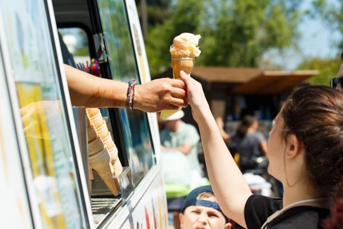 cropped-hand-giving-ice-cream-girl-from-van.jpg