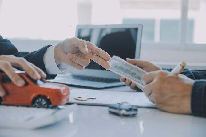 closeup-asian-male-people-car-salesman-sales-manager-offers-sell-car-explains-reads-terms-signing-car-contract-insurance.jpg