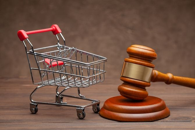 shopping-basket-judge-gavel-wooden-brown-background.jpg