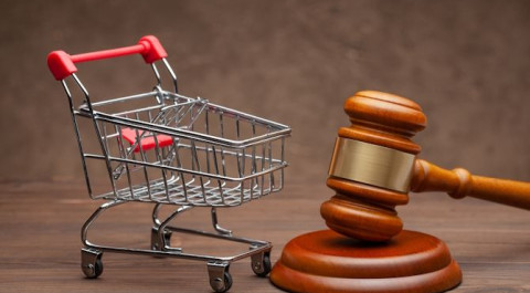 shopping-basket-judge-gavel-wooden-brown-background.jpg